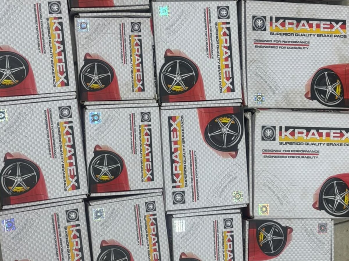 Stacks of Kratex brake pad boxes