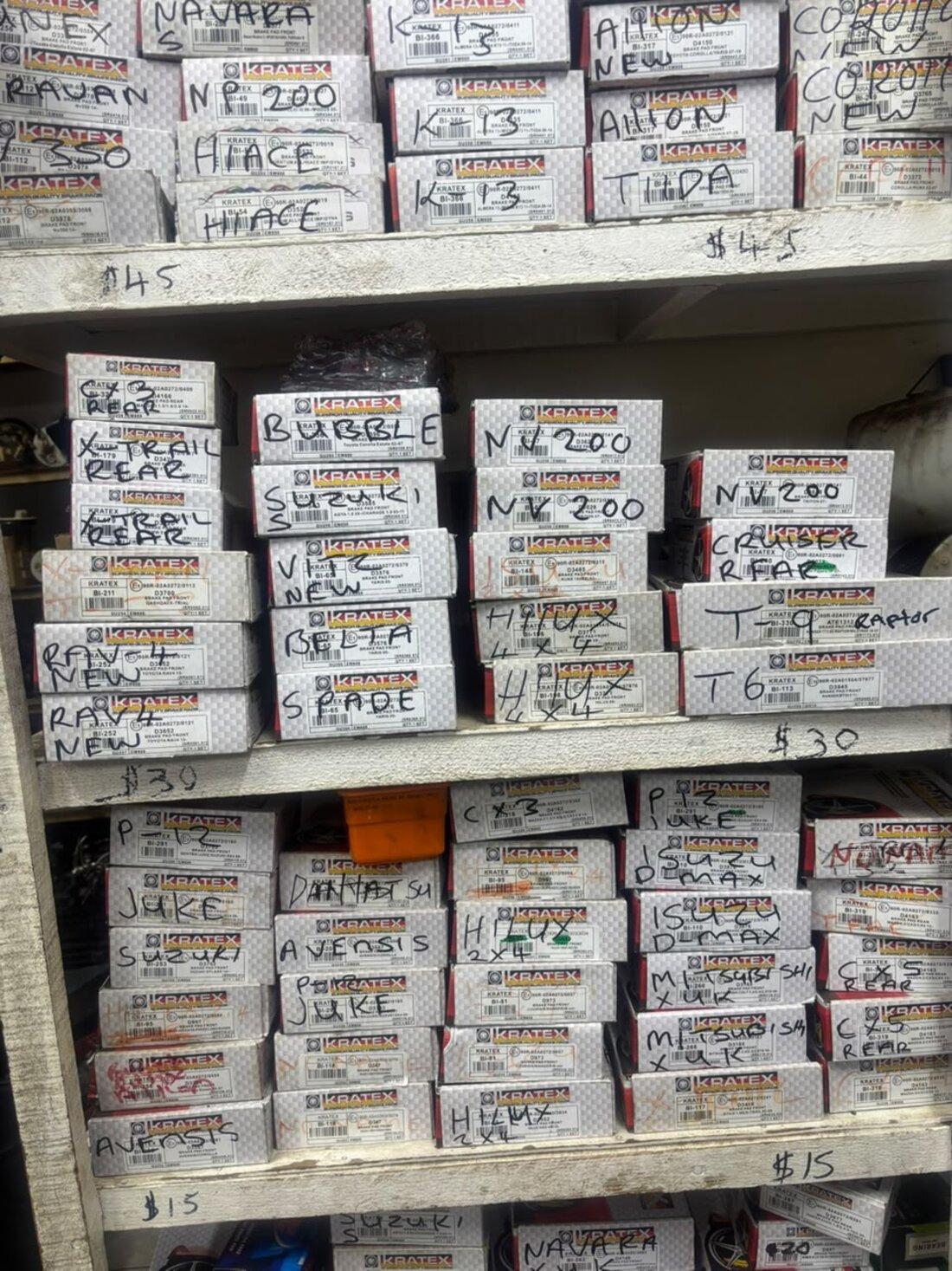Shelves of Kratex brake pad boxes labelled by vehicle model at Righteous Motor Spares